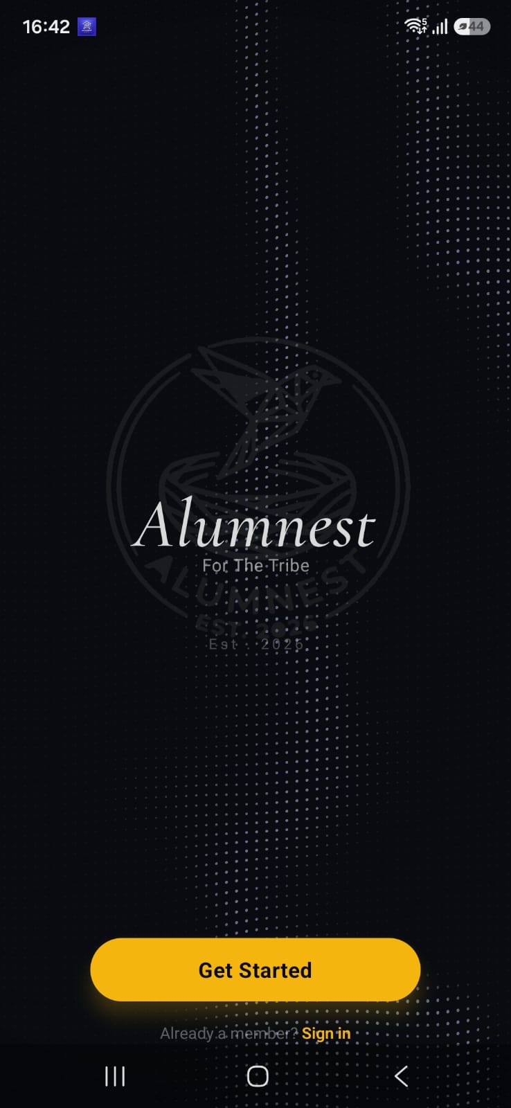 Alumnest app welcome screen with the tribe crest and Get Started